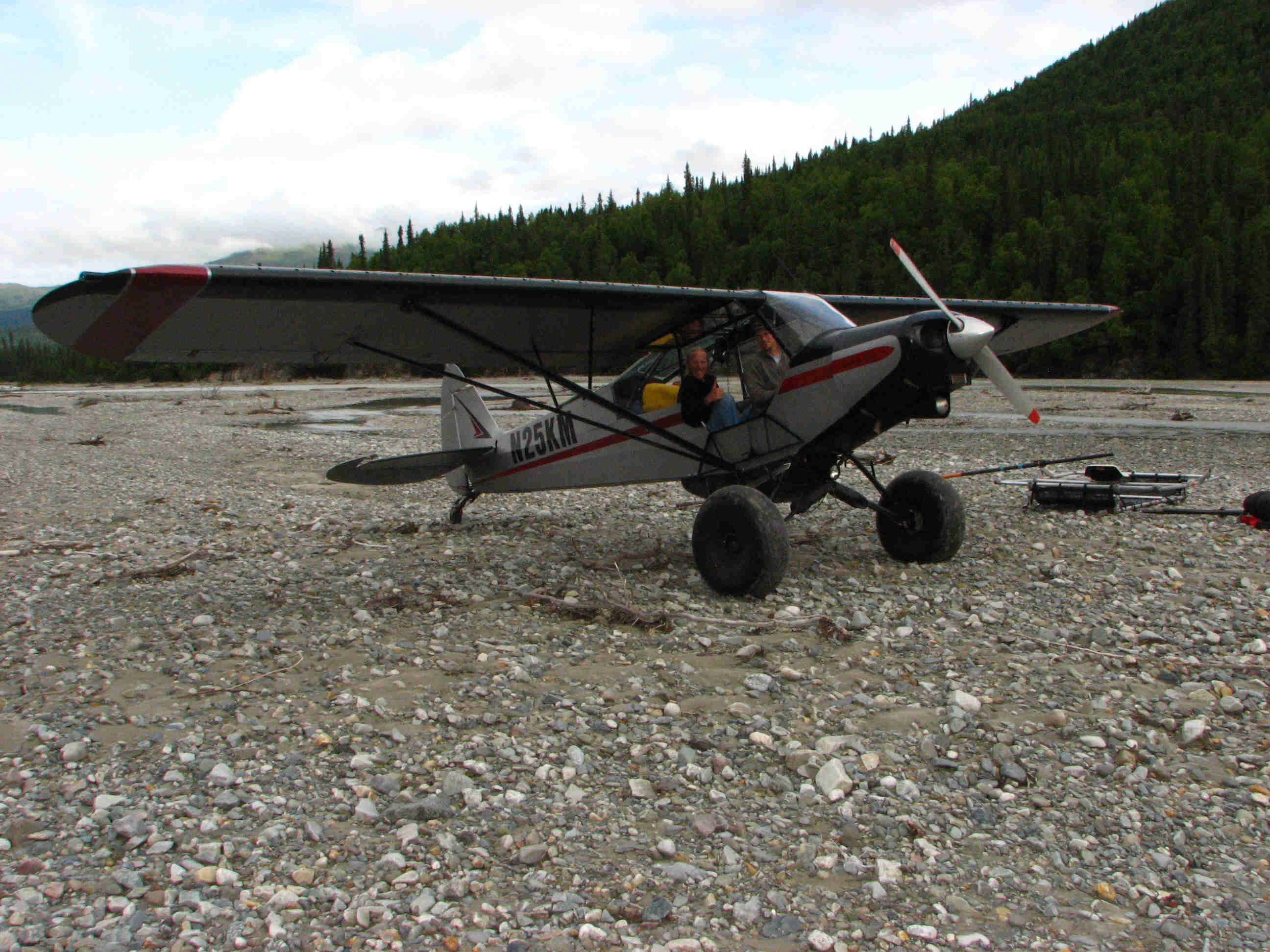 Cub landing on gravel bar - upper Talkeetna River Float Trip River - ALASKA RAFT CONNECTION